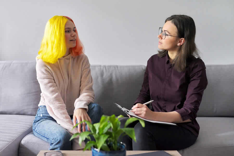 Teen LGBT girl receiving counseling